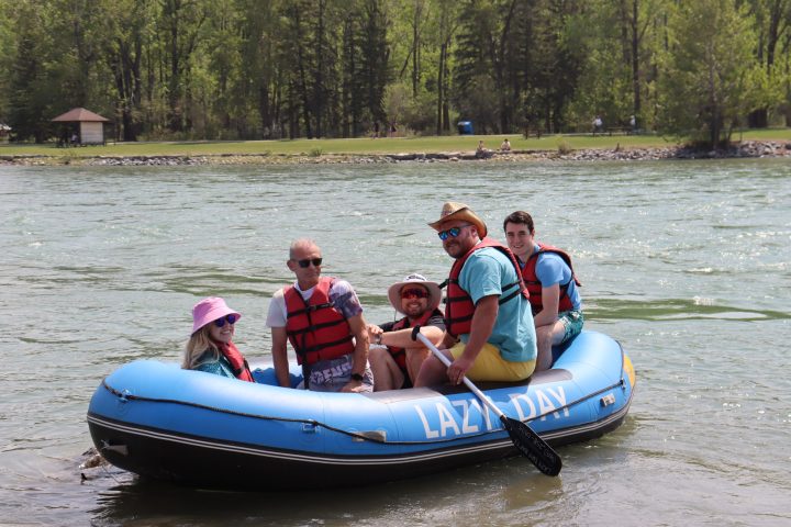 a group of people riding on the back of a boat