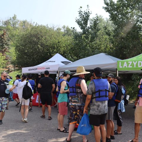 a group of people standing in front of a crowd