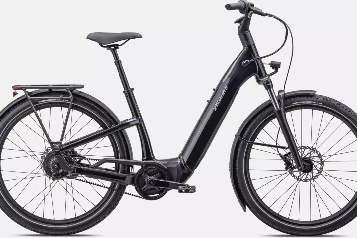 Black electric bicycle with step-through frame and rear rack.