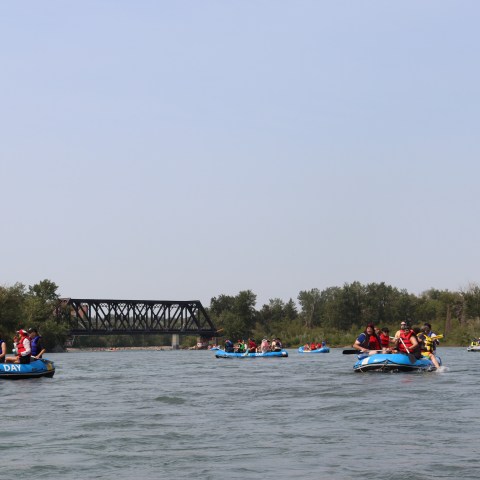 a group of people in a boat on a body of water