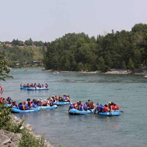 a group of people in a boat on a body of water
